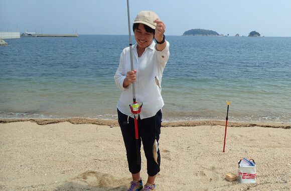 魚を釣って笑顔